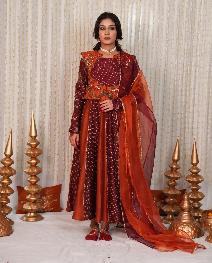 Sindoori and santari Anarkali set with jacket.
